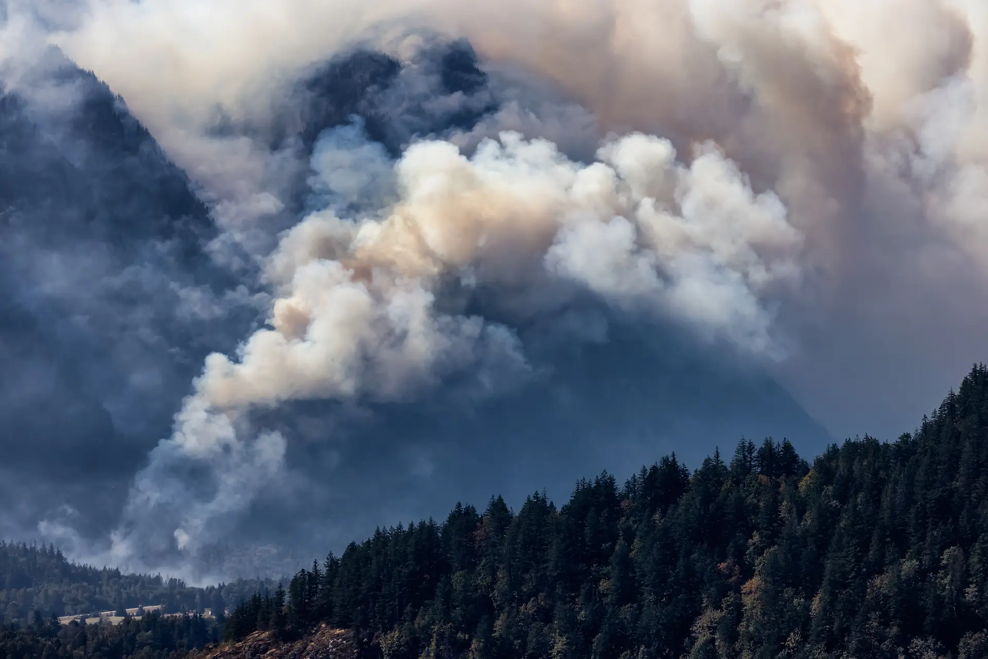 Wildfire smoke plume in valley